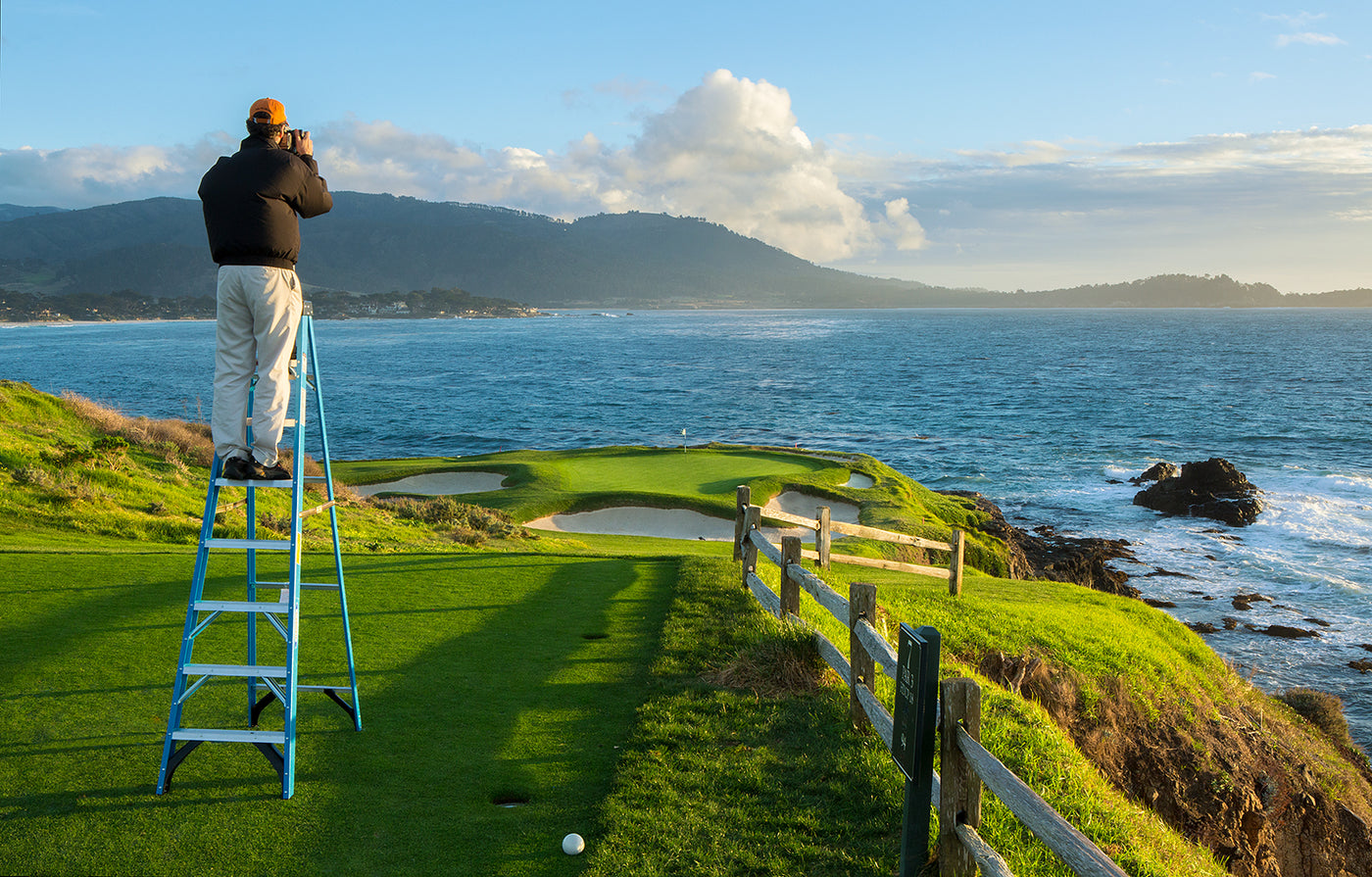 Evan Schiller Photographing the 7th hole at Pebble Beach Golf Links at sunset